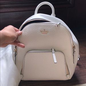 KATE SPADE WHITE CARTER STREET CADEN BACKPACK gold